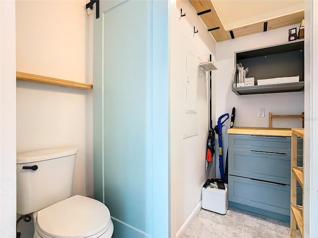 bathroom featuring tile floors, toilet, and vanity