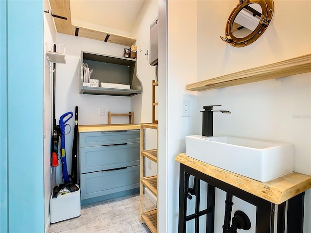 bathroom with tile flooring and sink