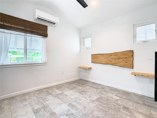 empty room with a wall mounted AC, light tile flooring, and a healthy amount of sunlight