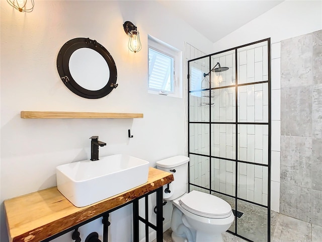 bathroom featuring walk in shower, vaulted ceiling, vanity, and toilet