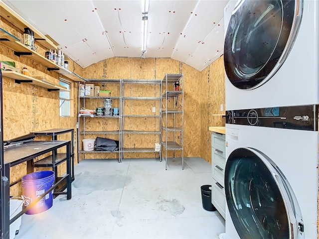 laundry area featuring stacked washer and dryer