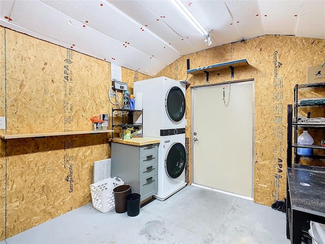 washroom featuring stacked washer / dryer