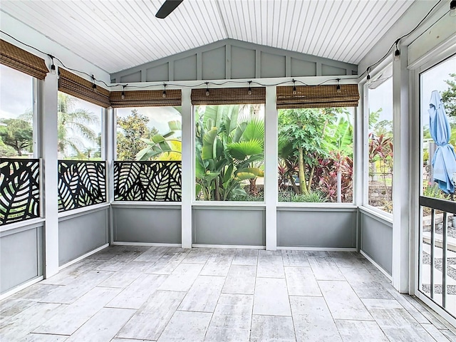 unfurnished sunroom featuring ceiling fan and lofted ceiling