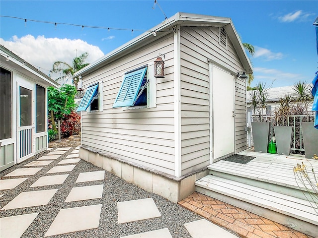 view of side of home featuring a deck