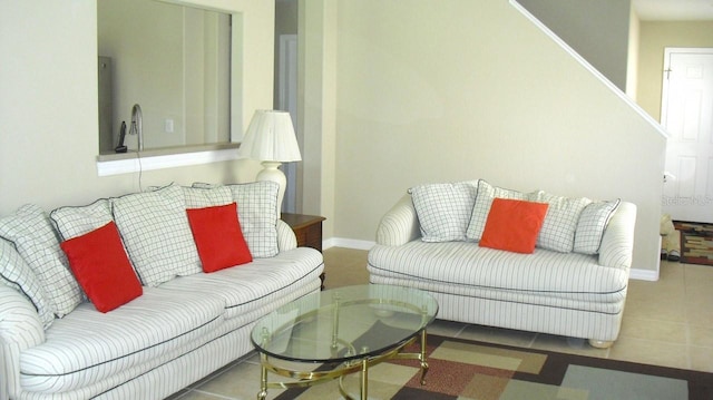 living room with dark tile patterned floors