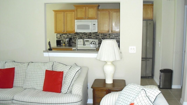 living area featuring tile patterned flooring