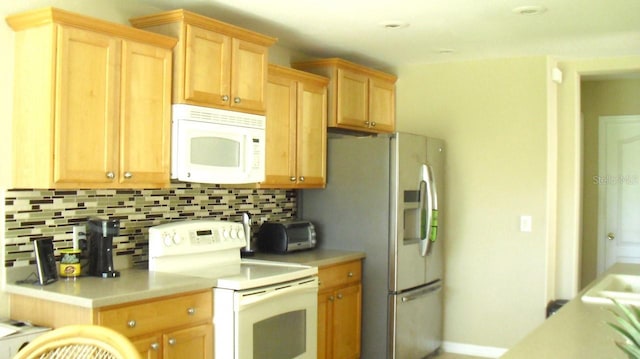 kitchen with white appliances, light brown cabinets, a toaster, light countertops, and tasteful backsplash