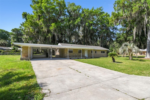 ranch-style house with a carport and a front yard