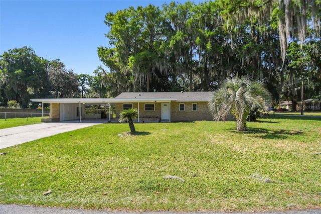 single story home featuring a carport and a front lawn