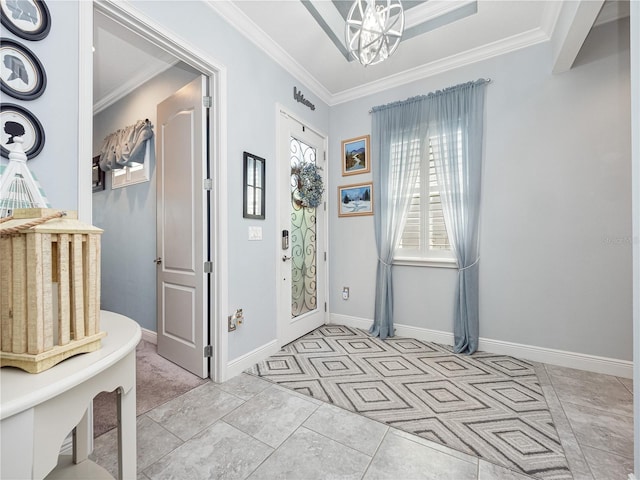 tiled entrance foyer featuring a notable chandelier and ornamental molding