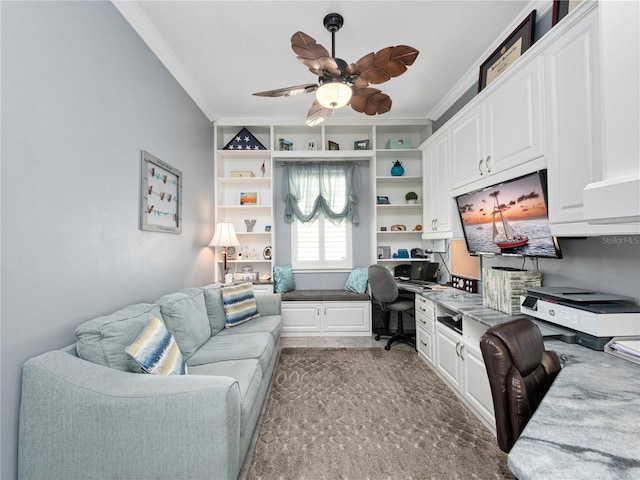 office area with carpet, ornamental molding, and ceiling fan