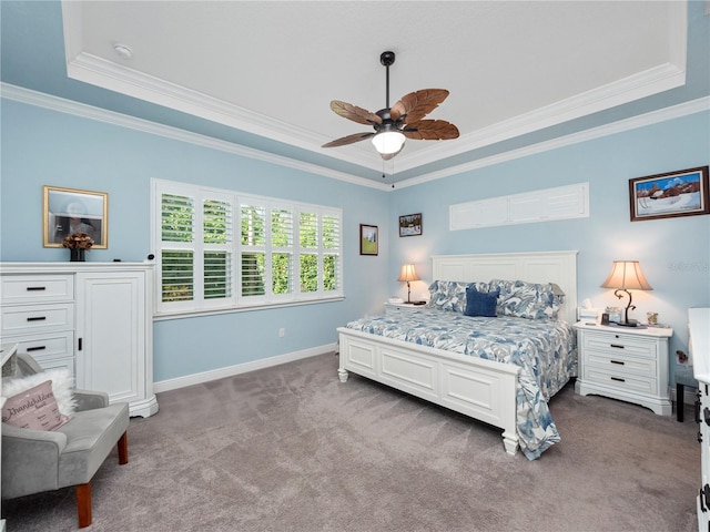 carpeted bedroom with crown molding, ceiling fan, and a raised ceiling