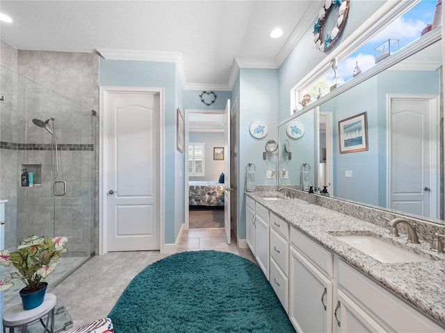 bathroom with crown molding, double sink, a shower with shower door, tile floors, and oversized vanity