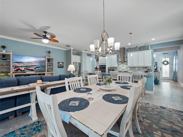 dining area with ornamental molding, tile floors, and ceiling fan with notable chandelier