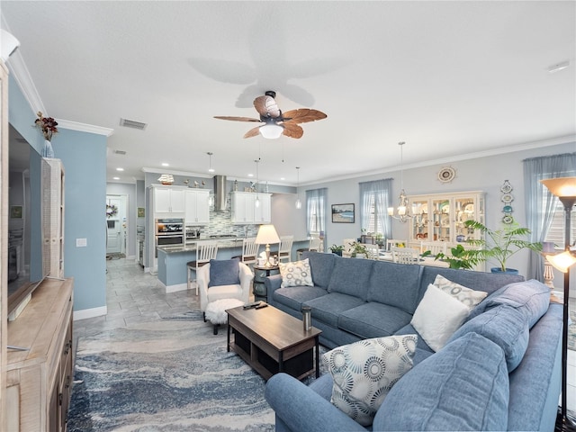 tiled living room with crown molding and ceiling fan with notable chandelier