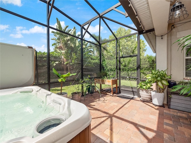 sunroom featuring a hot tub