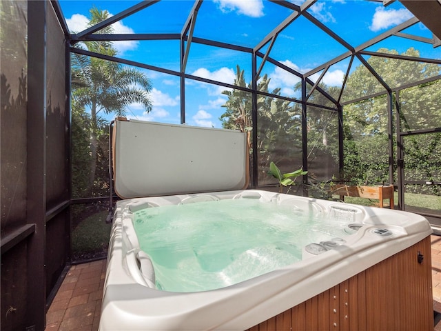 sunroom / solarium with a hot tub