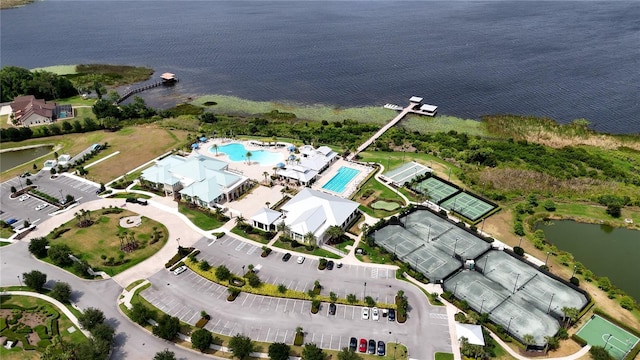 birds eye view of property with a water view