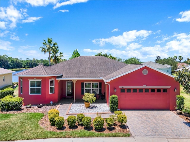 ranch-style house featuring a garage