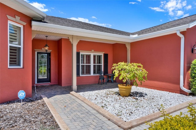 doorway to property featuring a patio