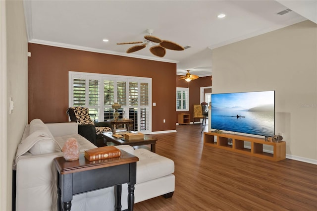 living room featuring ornamental molding, wood-type flooring, and ceiling fan