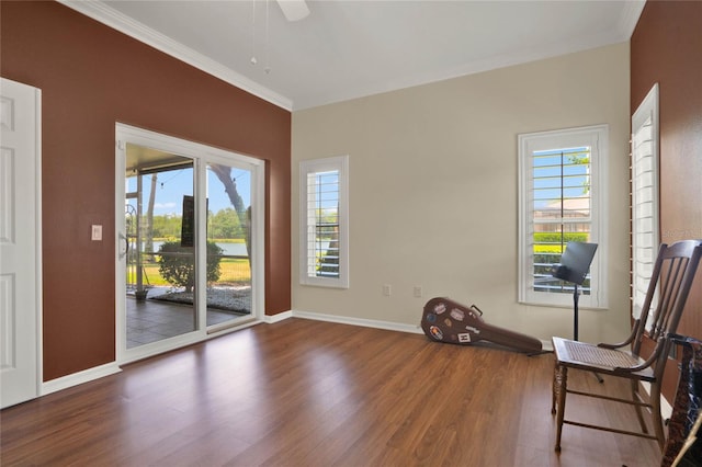 unfurnished room with plenty of natural light, ornamental molding, ceiling fan, and dark hardwood / wood-style floors