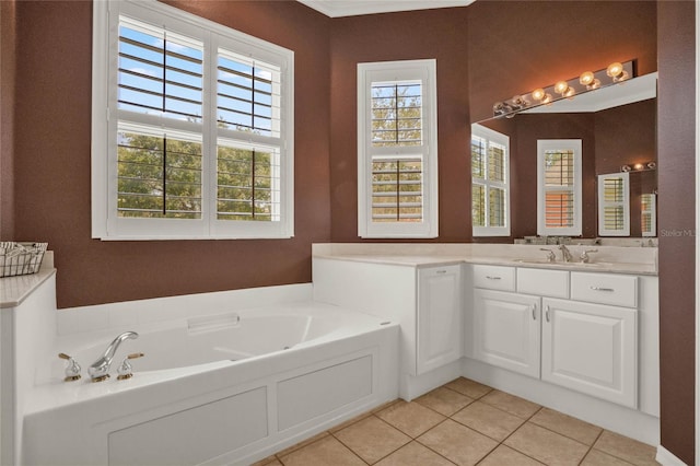 bathroom with a bath to relax in, oversized vanity, and tile floors