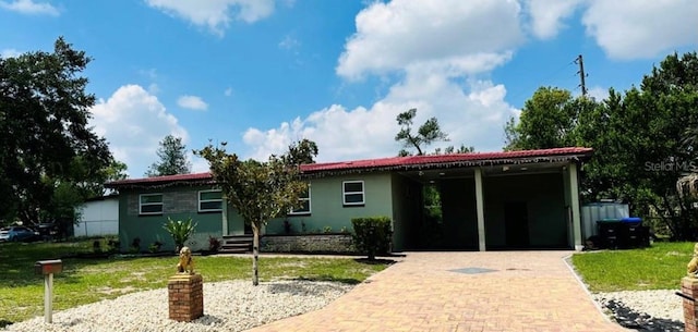 ranch-style home featuring a carport