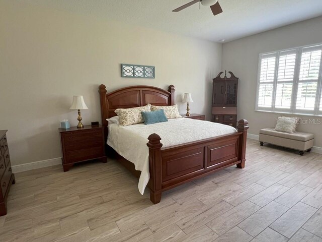 bedroom featuring ceiling fan and light wood-type flooring