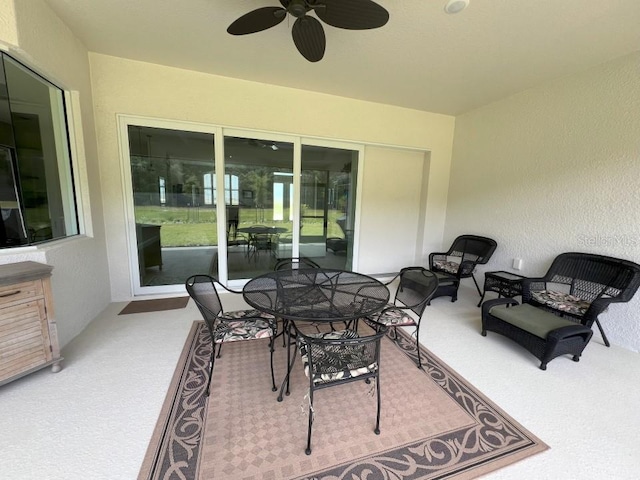 view of patio featuring ceiling fan