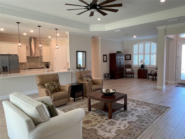 3962 Kennebunk Loop, Mount Dora, FL 32757 - living room with ceiling fan, light wood-type flooring, recessed lighting, ornamental molding, and baseboards