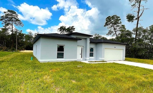 exterior space with a front yard and a garage