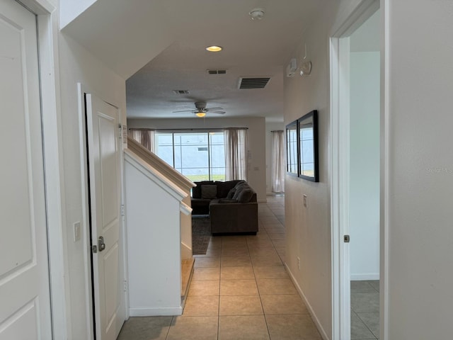 corridor featuring light tile flooring