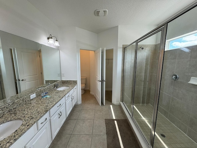 bathroom with an enclosed shower, toilet, and tile floors