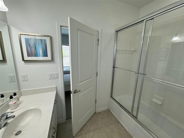 bathroom featuring tile flooring, a shower with door, and large vanity