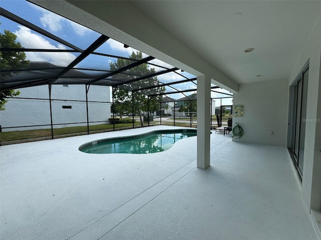 view of pool featuring a patio and a lanai