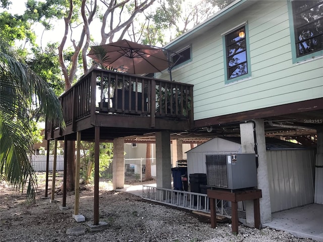 rear view of house featuring a deck