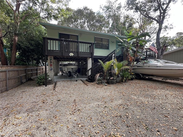 back of property featuring fence