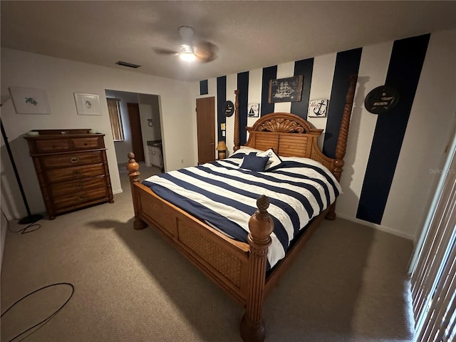 bedroom with baseboards, ceiling fan, visible vents, and light colored carpet