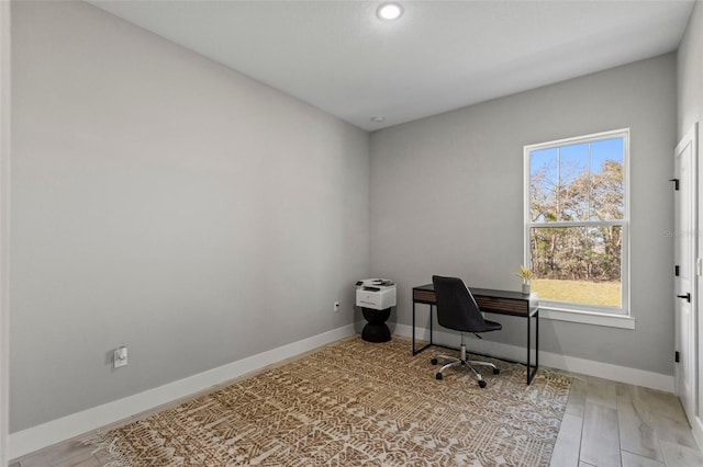 home office with light wood-type flooring