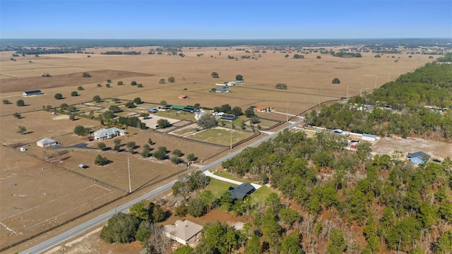 birds eye view of property with a rural view