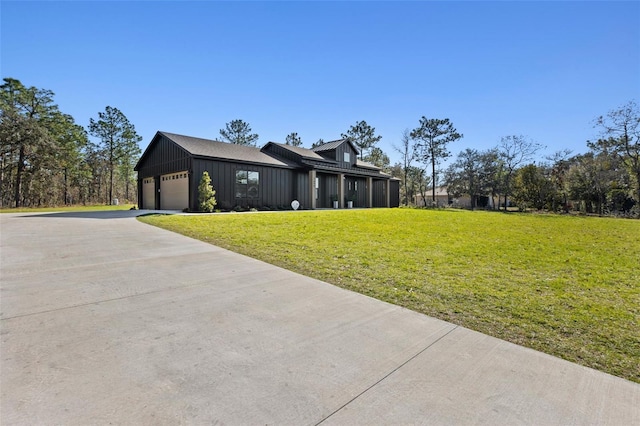 view of front of home with a garage and a front yard