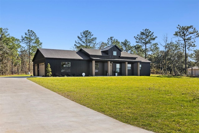 view of front facade with a front yard and a garage