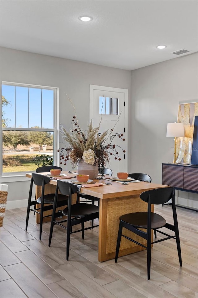 dining area featuring light wood-type flooring