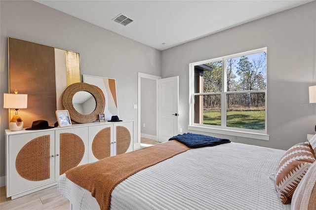 bedroom with light hardwood / wood-style floors