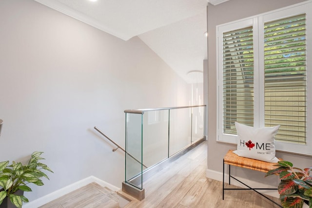 corridor with light hardwood / wood-style floors