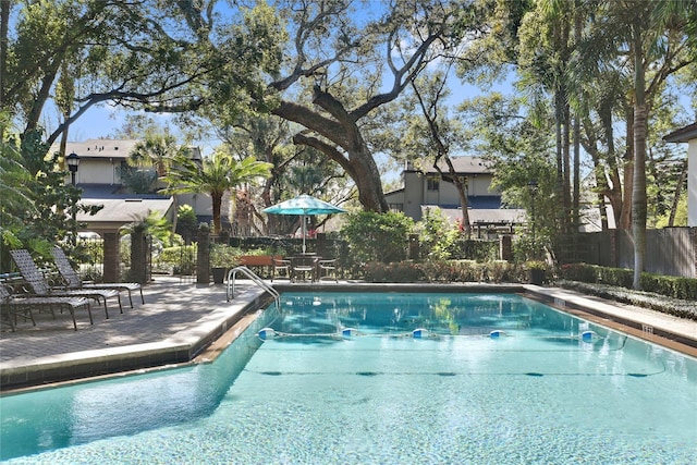 view of swimming pool with a patio