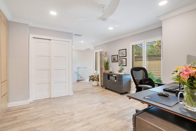 office space featuring ornamental molding, light hardwood / wood-style floors, and ceiling fan