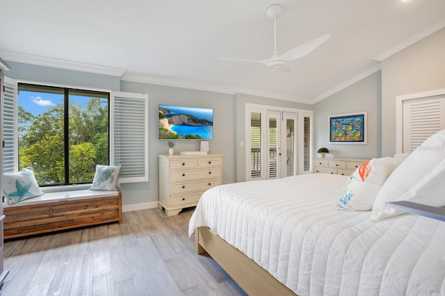 bedroom featuring multiple windows, ornamental molding, and light hardwood / wood-style floors