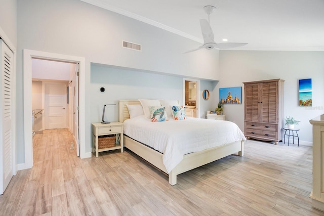 bedroom with ornamental molding, high vaulted ceiling, and light hardwood / wood-style flooring